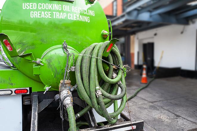 grease trap pumping truck servicing a restaurant in Armada MI